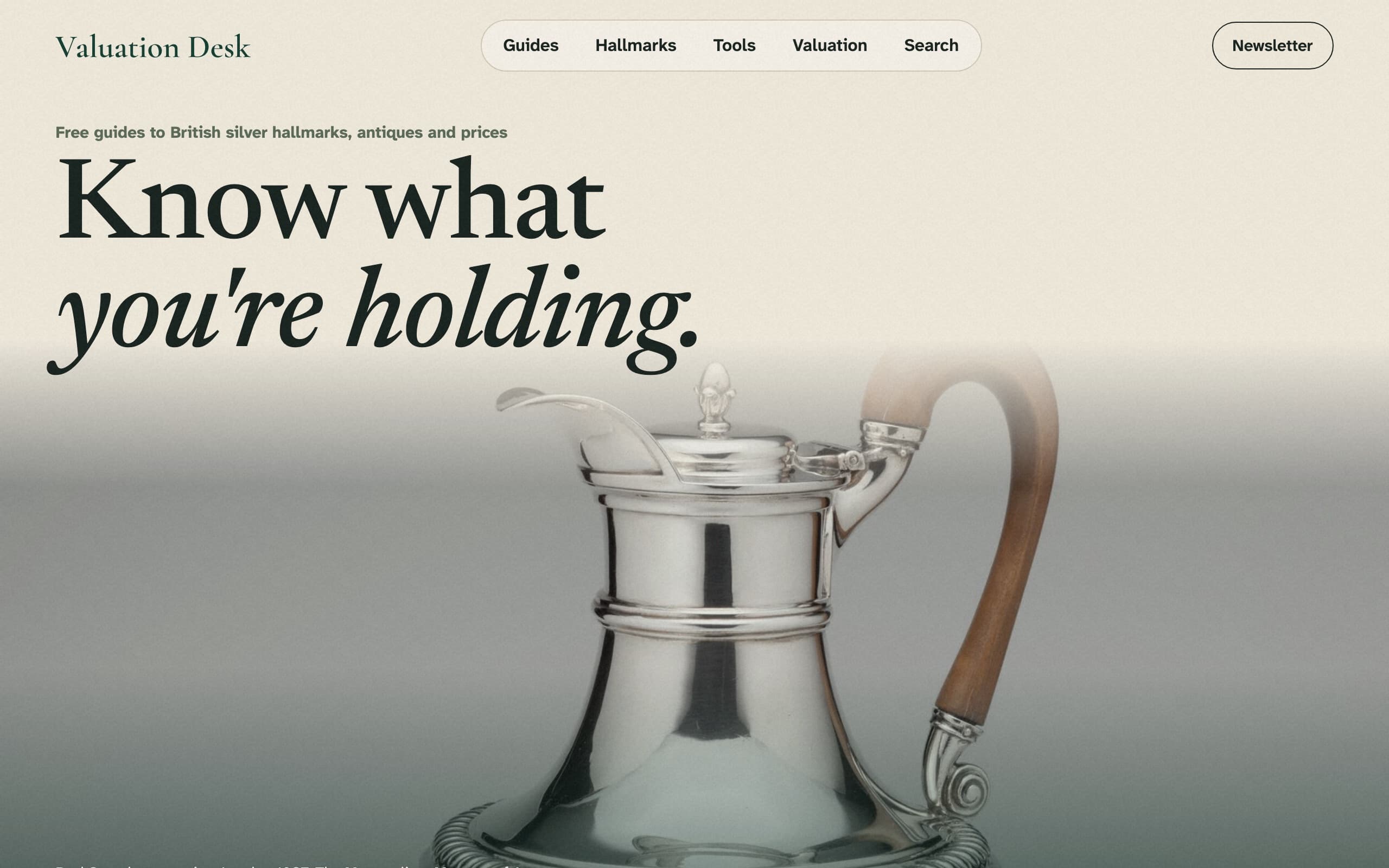 The Valuation Desk home page, with the headline "Know what you're holding" over a photograph of a silver jug